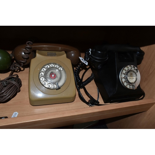 413 - A GROUP OF EIGHT ROTARY DIAL VINTAGE TELEPHONES to include seven GEN 746 telephones in various shade... 