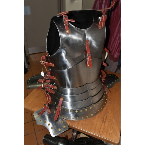 417 - A HALF SET OF ARMOUR AND MANNEQUIN comprising a cuirass and two greaves, with leather buckles, suita... 