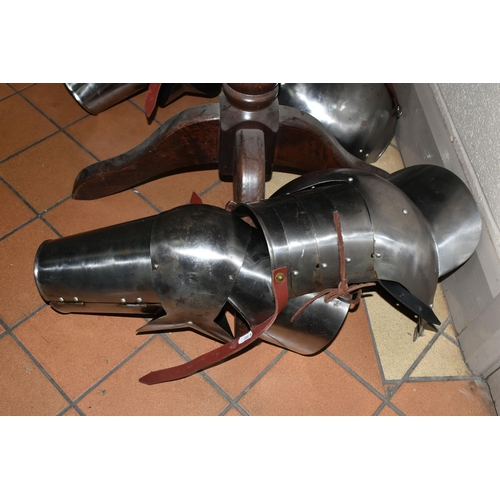 417 - A HALF SET OF ARMOUR AND MANNEQUIN comprising a cuirass and two greaves, with leather buckles, suita... 