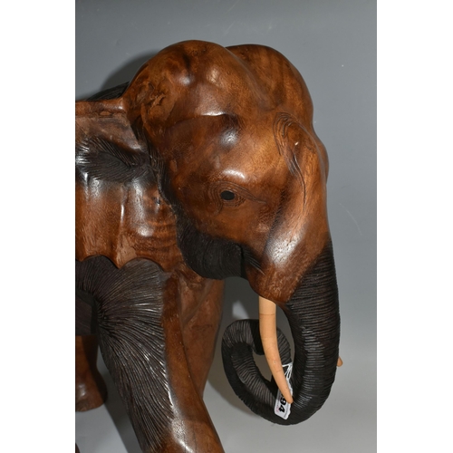 494 - A LARGE HAND CARVED WOODEN ELEPHANT, a carved heavy hard wood elephant, height 50cm x 50cm (1) (Cond... 