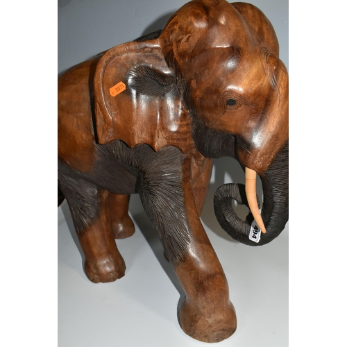 494 - A LARGE HAND CARVED WOODEN ELEPHANT, a carved heavy hard wood elephant, height 50cm x 50cm (1) (Cond... 