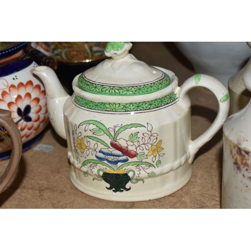 497 - A GROUP OF STONEWARE AND CERAMICS, comprising a Victorian jelly mould, foot warmer, jars and bottles... 