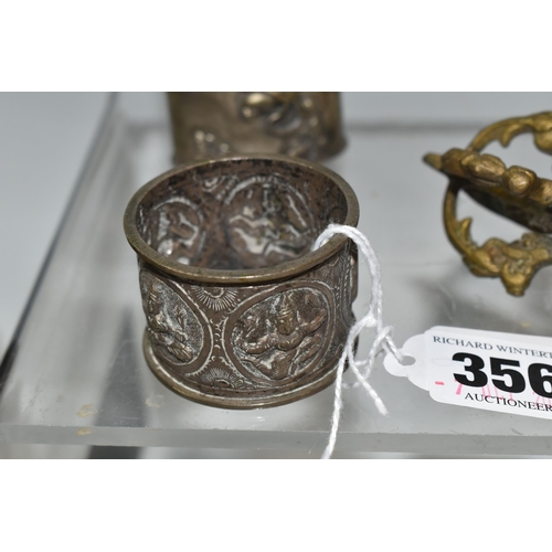 356 - A GROUP OF ASIAN METAL WARE, possibly Tibetan and Indian in origin, comprising a napkin ring decorat... 