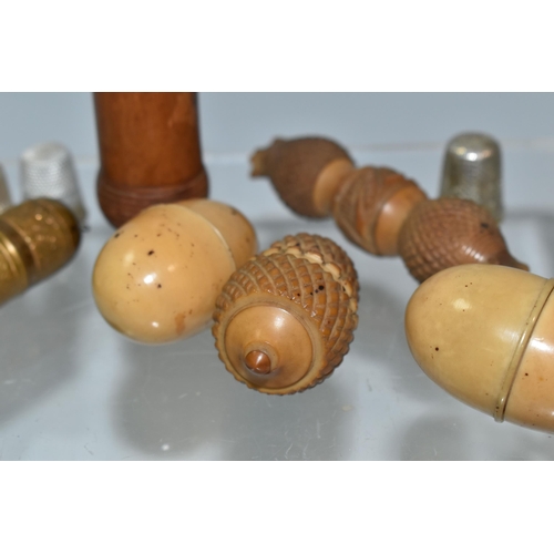 370 - A BOX OF THIMBLE HOLDERS AND A NEEDLE CASE, to include three vegetable ivory thimble holders, each w... 