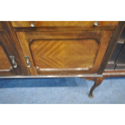 1200 - A 20TH CENTURY MAHOGANY SIDEBOARD, with an oval bevelled mirror plate, two drawers, above double cup... 