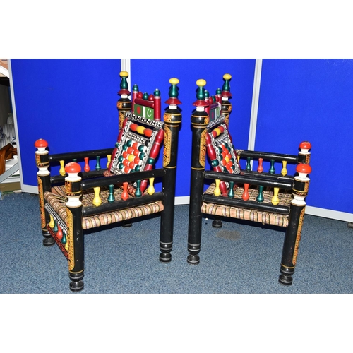 1242 - A PAIR OF 20TH CENTURY PAKISTANI CHARPAI CHAIRS, brightly painted decoration and woven fabric seats,... 