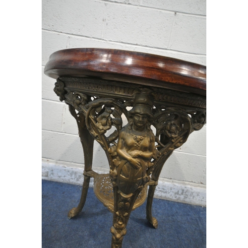 1201 - A GOLD PAINTED CAST IRON PUB TABLE, depicting females, flowers, shields, etc, on shaped legs, with p... 