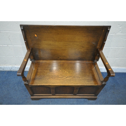 1213 - A 20TH CENTURY OAK MONKS BENCH, with a hinged storage seat, width 107cm x depth 54cm x height 74cm (... 