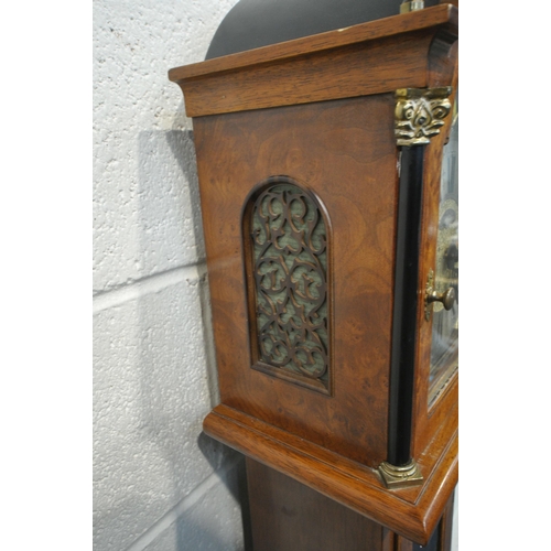 1215 - A LATE 20TH CENTURY WALNUT GRANDMOTHER CLOCK, the arched hood with three brass finials, the glass do... 