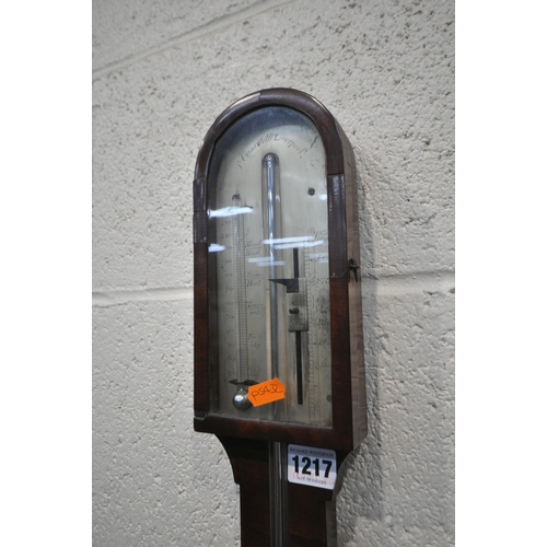 1217 - A GEORGIAN MAHOGANY CISTERN BAROMETER, the arched glass door enclosing a face signed J Casartelli, L... 