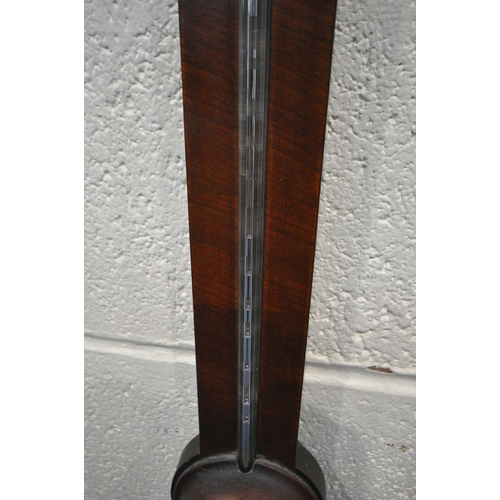 1217 - A GEORGIAN MAHOGANY CISTERN BAROMETER, the arched glass door enclosing a face signed J Casartelli, L... 