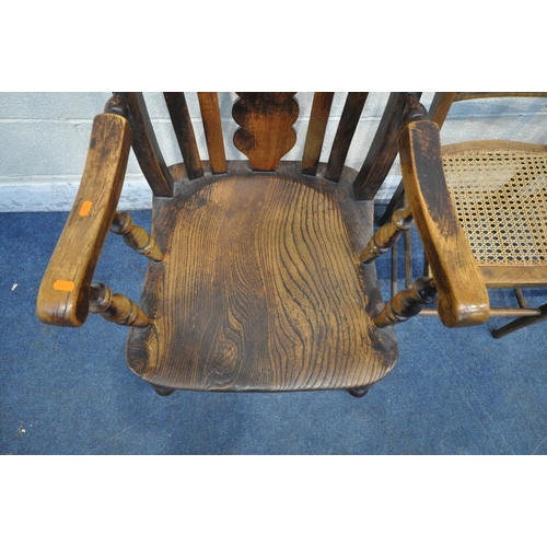 1220 - AN EARLY 20TH CENTURY ELM SEATED ARMCHAIR, with a central splat back, turned supports, scrolled armr... 