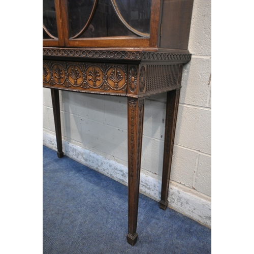 1297 - AN EARLY 20TH CENTURY MAHOGANY BOOKCASE ON STAND, the top with an overhanging cornice, the double as... 