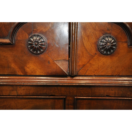 1300 - A GEORGIAN FLAME MAHOGANY CONVERTED LINEN PRESS, the cornice with blind fretwork, double cupboard do... 