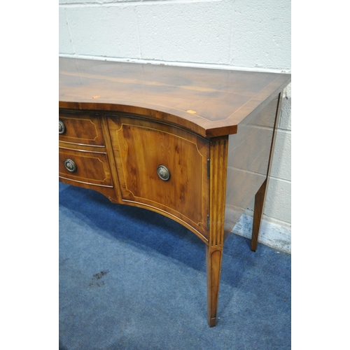 1304 - A YEWWOOD SERPENTINE SIDEBOARD, with two drawers, width 153cm x depth 56cm x height 85cm, and a yew ... 