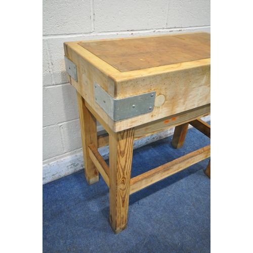 1308 - A BUTCHERS BLOCK, on a separate pine stand, width 84cm x depth 46cm x height 84cm, and a ham clamp (... 