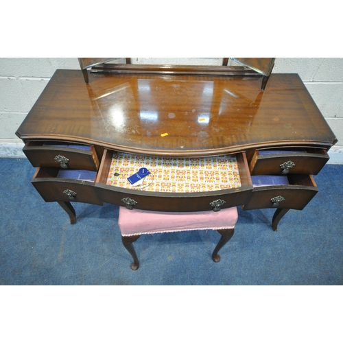 1226 - A 20TH CENTURY MAHOGANY SERPENTINE DRESSING TABLE, fitted with a triple dressing mirror, five assort... 