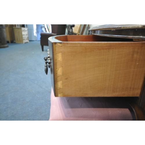 1226 - A 20TH CENTURY MAHOGANY SERPENTINE DRESSING TABLE, fitted with a triple dressing mirror, five assort... 