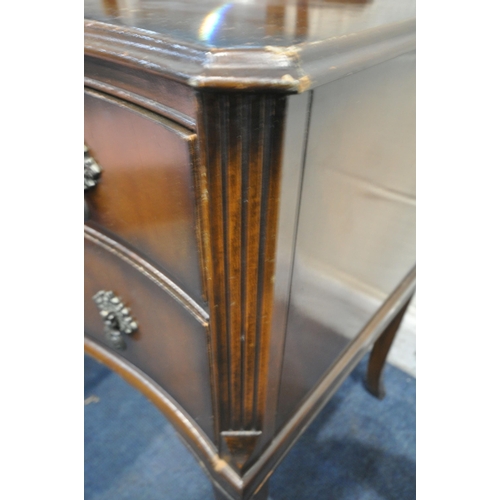 1226 - A 20TH CENTURY MAHOGANY SERPENTINE DRESSING TABLE, fitted with a triple dressing mirror, five assort... 