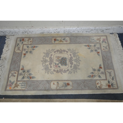 1228 - A CREAM GROUND CHINESE WOOLEN RUG, 180cm x 92cm, another rectangular rug, an real lambskin rug, alon... 