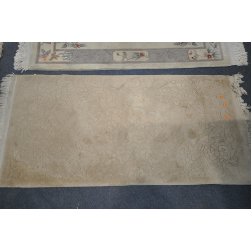 1228 - A CREAM GROUND CHINESE WOOLEN RUG, 180cm x 92cm, another rectangular rug, an real lambskin rug, alon... 