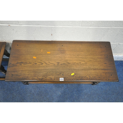 1231 - A 20TH CENTURY OAK COFFEE TABLE, raised on turned legs, united by stretchers, width 92cm x depth 38c... 