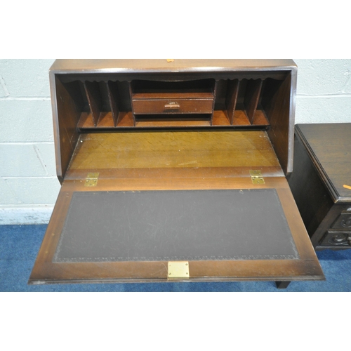 1233 - A LATE 20TH CENTURY OAK BUREAU, the linenfold fall front door enclosing a fitted interior, above thr... 