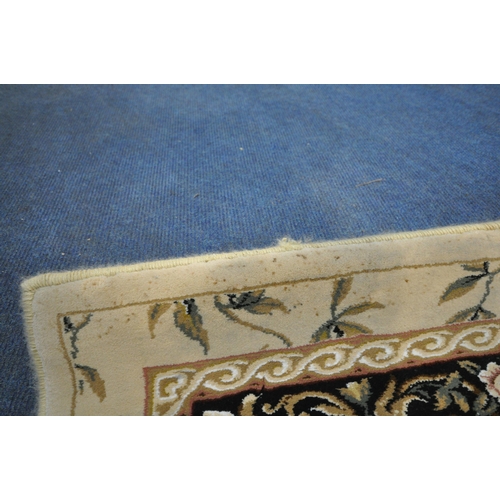 1246 - AN IVORY GROUND RECTANGULAR RUG, with foliate decorations, and a multi-strap border, 230cm x 160cm (... 