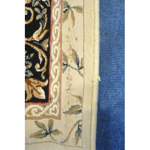 1246 - AN IVORY GROUND RECTANGULAR RUG, with foliate decorations, and a multi-strap border, 230cm x 160cm (... 