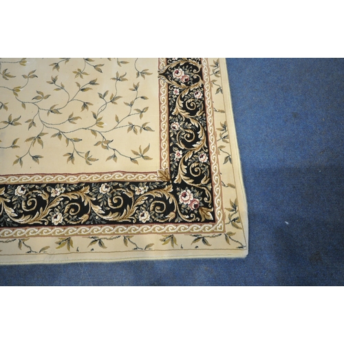 1246 - AN IVORY GROUND RECTANGULAR RUG, with foliate decorations, and a multi-strap border, 230cm x 160cm (... 