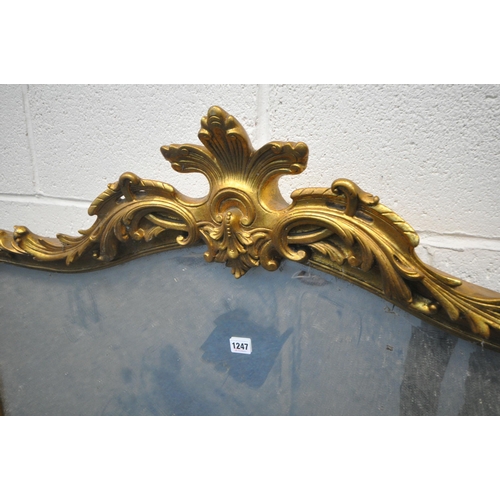 1247 - A 20TH CENTURY GILT FRAMED OVERMANTLE MIRROR, with an arched top and foliate detail, 126cm x 101cm (... 