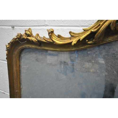 1247 - A 20TH CENTURY GILT FRAMED OVERMANTLE MIRROR, with an arched top and foliate detail, 126cm x 101cm (... 