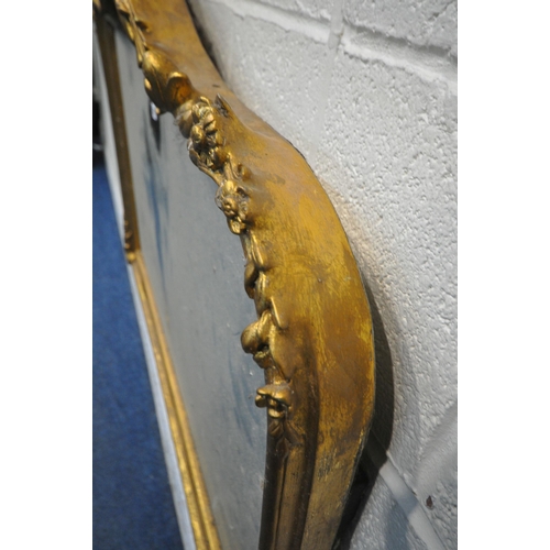 1247 - A 20TH CENTURY GILT FRAMED OVERMANTLE MIRROR, with an arched top and foliate detail, 126cm x 101cm (... 