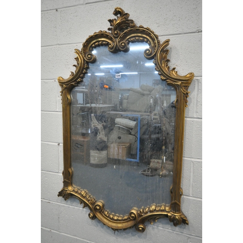 1248 - A 20TH CENTURY GILT FRAMED OVERMANTLE MIRROR, with a shaped foliate top and bottom, and scrolled fol... 