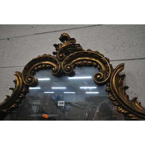 1248 - A 20TH CENTURY GILT FRAMED OVERMANTLE MIRROR, with a shaped foliate top and bottom, and scrolled fol... 