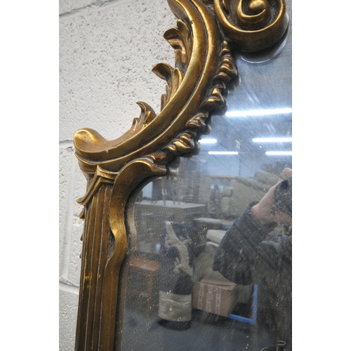 1248 - A 20TH CENTURY GILT FRAMED OVERMANTLE MIRROR, with a shaped foliate top and bottom, and scrolled fol... 