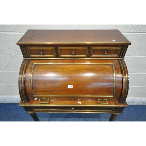 1249 - A LOUIS XVI STYLE MAHOGANY CYLINDER DESK, retailer label to reverse reading Leon Molinghem, with gil... 