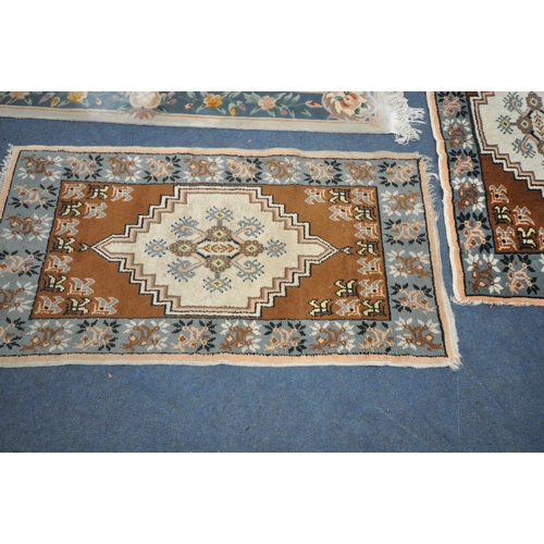 1266 - A CHINESE CREAM WOOLLEN RUG, 192cm x 92cm, and two smaller rugs (condition report: Chinese rug disco... 