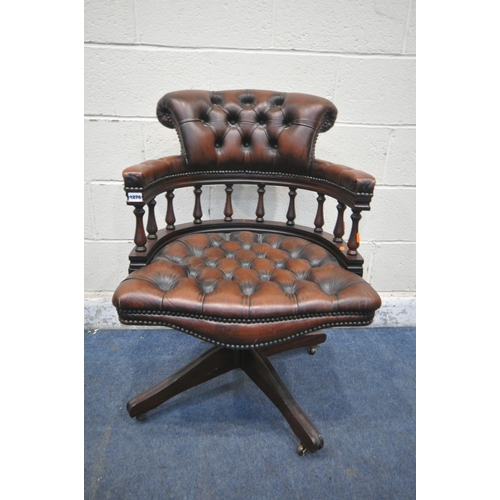 1276 - A BROWN BUTTONED LEATHER SWIVEL OFFICE CHAIR, on casters (condition report: scuffs and scratches to ... 