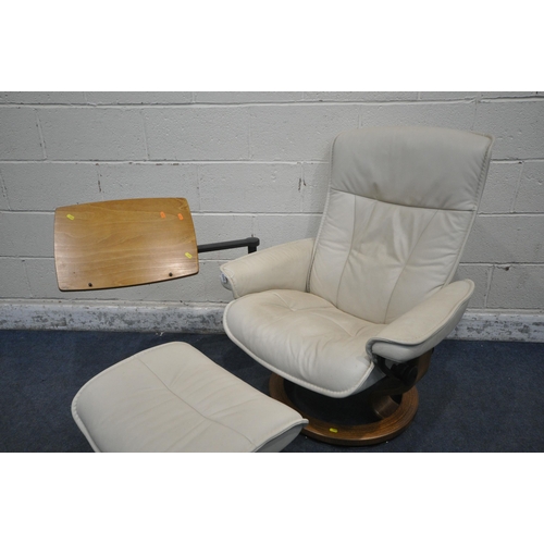 1277 - AN EKORNES STRESSLESS CREAM LEATHER SWIVEL RECLINING CHAIR, with an adjustable side tray, and footst... 