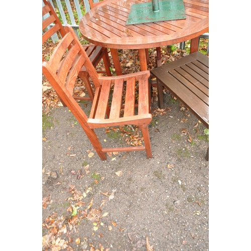 1011 - A MODERN TEAK GARDEN TABLE, FOUR MATCHING CHAIRS, occasional table and a parasol frame with metal ba... 