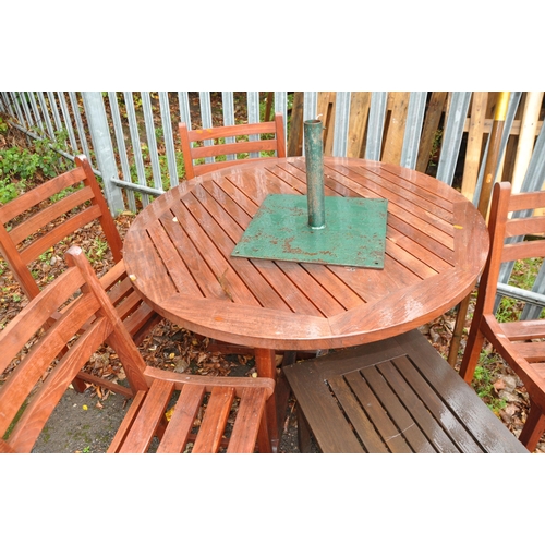 1011 - A MODERN TEAK GARDEN TABLE, FOUR MATCHING CHAIRS, occasional table and a parasol frame with metal ba... 