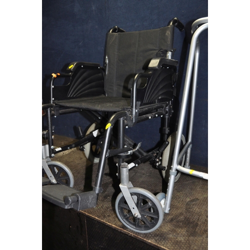 1056 - A FOLDING WHEELCHAIR WITH TWO FOOT RESTS and a walking aid (2)