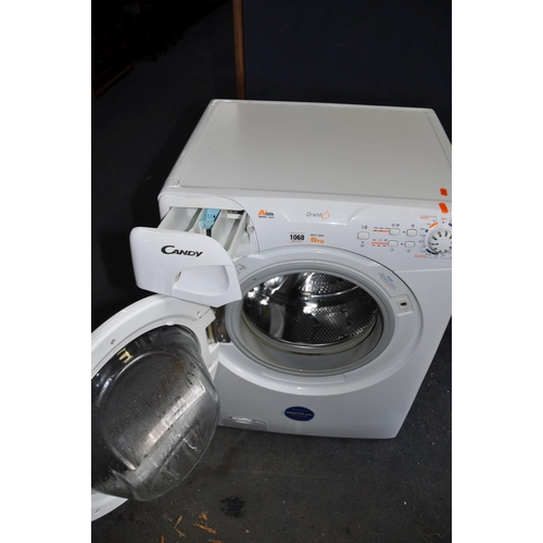 1068 - A CANDY GO F 662 WASHING MACHINE width 60cm depth 55cm height 84cm and an Electrolux vacuum cleaner ... 