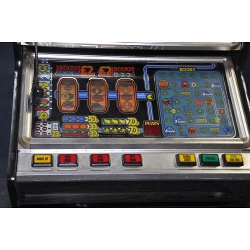 1069 - A JPM FRUIT MACHINE WITH 'FRUIT CHASER' GRAPHICS with two keys and a bag of coins and tokens, width ... 