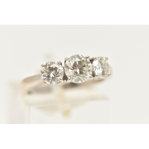 10 - AN 18CT WHITE GOLD THREE STONE DIAMOND RING, designed as three brilliant cut diamonds in claw settin... 