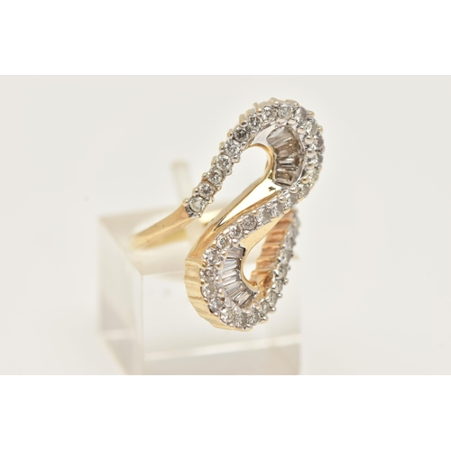 2 - A MODERN DIAMOND DRESS RING, the ring is of an abstract design, set with graduating tapered baguette... 