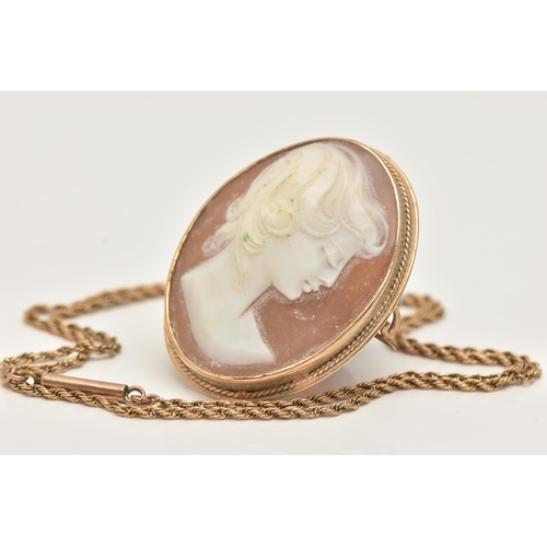 20 - A 9CT GOLD CAMEO BROOCH AND YELLOW METAL CHAIN, an oval shell cameo, collet set in yellow gold, fitt... 