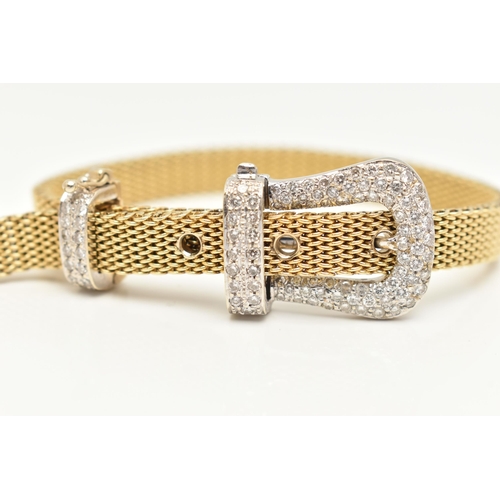 22 - A MODERN WHITE AND YELLOW METAL DIAMOND BUCKLE BRACELET, the front designed as a buckle set througho... 