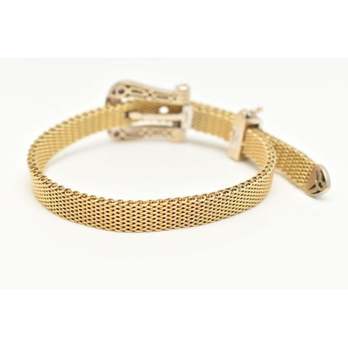 22 - A MODERN WHITE AND YELLOW METAL DIAMOND BUCKLE BRACELET, the front designed as a buckle set througho... 